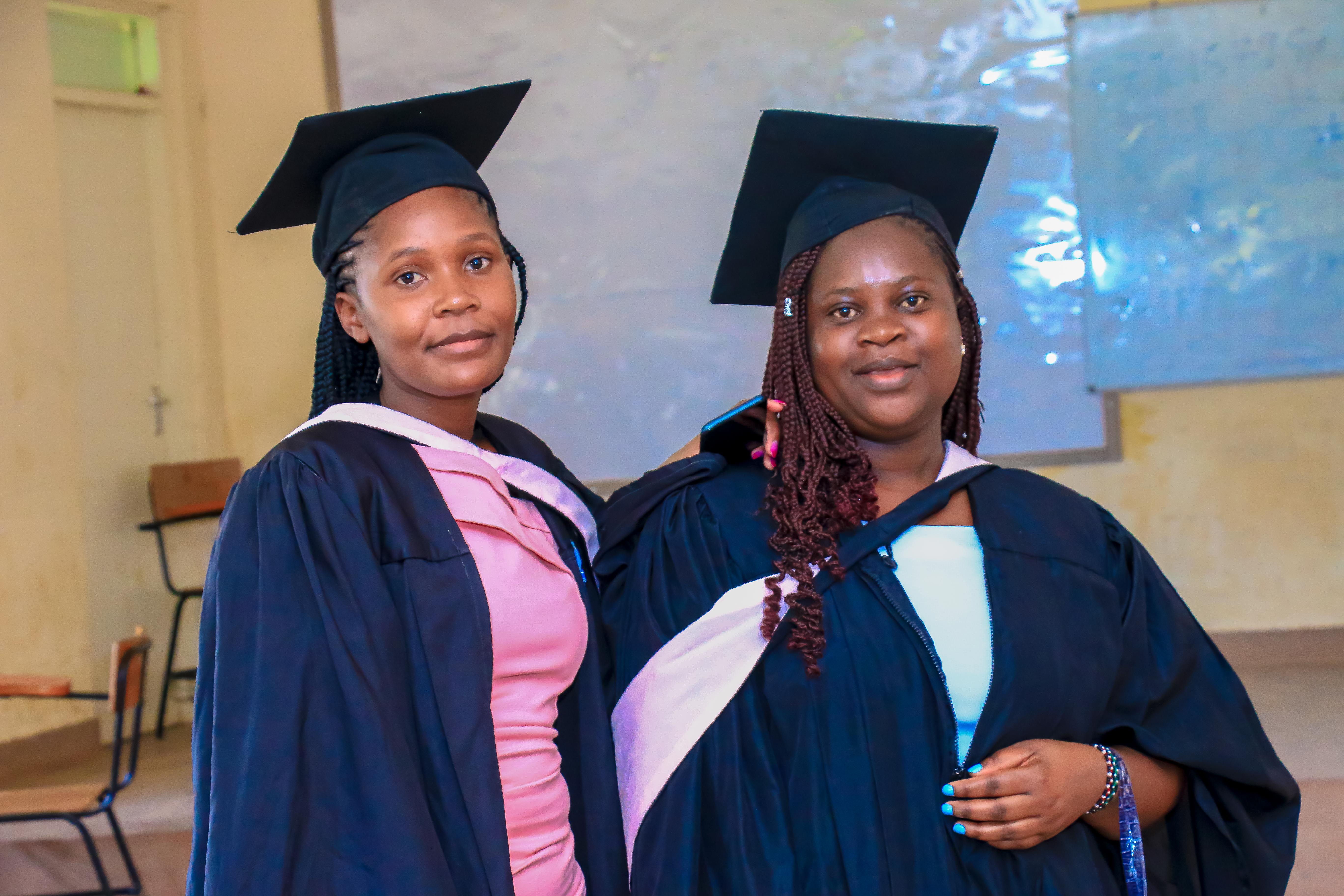 Two KASMS graduates in academic dress