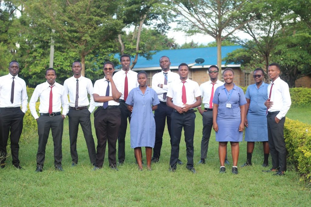 KASMS students standing together on the campus lawn